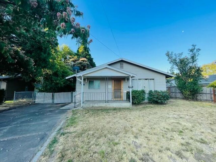 Charming Fixer in Rogue River - Endless Potential Awaits!
This 1963 handyman special offers 960 sq. ft. of living space with 2 bedrooms, 1 bathroom, laundry area, and a small workshop. Situated on a 0.32-acre R-2 zoned lot, the property features a fenced yard with mature trees, paved driveway, and a large covered storage area. Perfectly located across from Beck Field and within walking distance to shopping, schools, and the river — plus just one mile from I-5 for easy commuting.
Whether you're a savvy investor or a DIY enthusiast, this is your chance to transform a diamond in the rough into your dream home. Being sold as-is — opportunities like this don't last long! Schedule your private showing today.