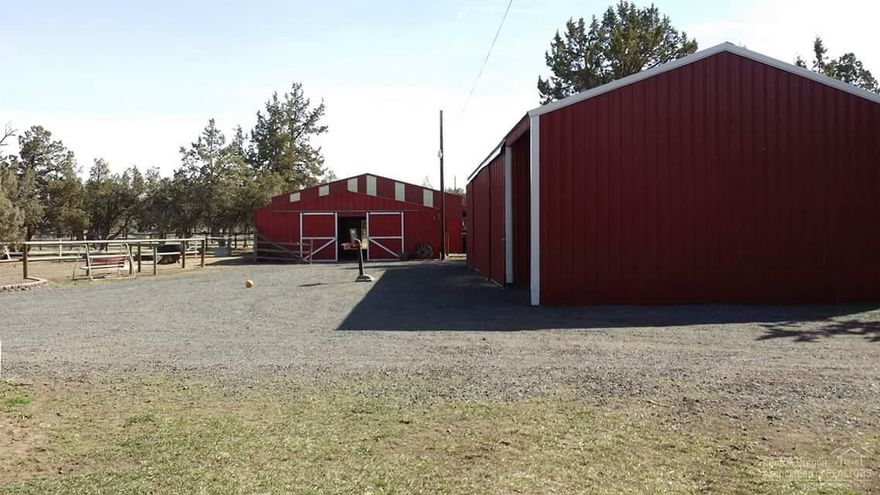 Do you have horses, goats, and chickens that need room to roam? Your country lifestyle will be complete with indoor and outdoor arenas. There is plenty of space for the horses with two barns and multiple fenced turnout areas. The first barn has 2 stalls with heated tack rooms, hay storage, and a wash rack. The smaller barn features 2 additional stalls, and both barns have water and electricity. There is also a huge shop with concrete floors on one side and hay storage on the other, as well as a carport.