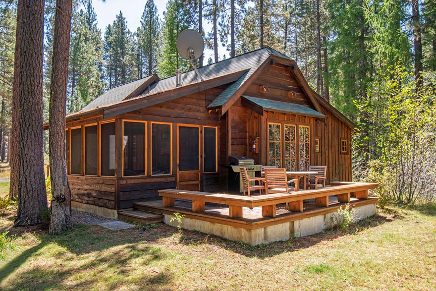 Experience a 1/4 share interest in a stunning 3 bedroom, 3 bathroom cabin at historic Lake Creek Lodge in Camp Sherman. This property beautifully combines modern amenities with the charm of yesteryear. Constructed in 2011, it is tastefully furnished with a blend of antiques & quality reproductions. The interior features fir plank floors, knotty pine paneling, & stone fireplace. The kitchen is equipped with butcher block countertops, a gas cooktop & farmhouse sink. Additional highlights include tile flooring & showers in the bathrooms, cedar decks, stone exterior accents, & secure storage. A beautifully appointed screened porch provides year-round comfort, offering views of the Lake Creek riparian area. The Shared Ownership Program manages maintenance, while amenities encompass a Lodge with a game rm, pool, tennis/pickleball courts, fly fishing pond, & trails. Recreational opportunities are plentiful including nearby golf, skiing & world-class fly fishing on the Metolius River.