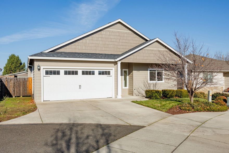 Recently updated Southwest Medford! This 3 bedroom 2 bathroom home is fully fenced, landscaped and turn key inside and out. Updated interior paint and flooring was just completed. The open concept and vaulted ceilings make this house great for entertaining. Spacious kitchen with oversized island and tons of storage, beautiful granite counter tops and a brand new induction stove/oven. Large master bedroom with engineered hardwood floors and a big walk in closet. Covered back patio and pleasant back yard.  Located in a quiet neighborhood cul-de-sac. Home feels as good as new!