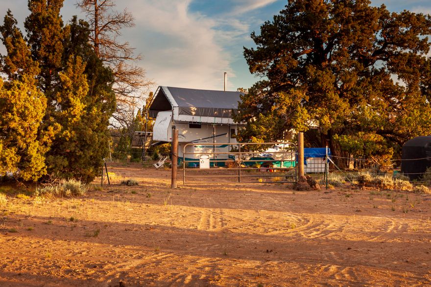 This non-buildable, recreational retreat, conveniently located near Bend and Prineville, offers a harmonious combination of seclusion and natural splendor. Enveloped by Juniper trees and bordered by distant hills and ridgelines, this property is the quintessential off-the-grid sanctuary for those seeking solace and a reconnection with the great outdoors. Remarkably, this property's location is distinctive, with access to public land, which hosts more than 255 miles of trails within the Millican Valley OHV System, along with boundless expanses of land waiting to be explored. Nearby attractions include Pine Mountain Observatory, several shooting ranges, the Dry River Canyon, and the Oregon Badlands Wilderness. Included with the property is a 5th-wheel RV, a 1,550-gallon water tank, a 275-gallon water tote, a 240-watt solar array, a commercial 8'W x 9'H x 20'L storage container, and many extras. Don't let this one pass you by - ask your broker to schedule a showing today!