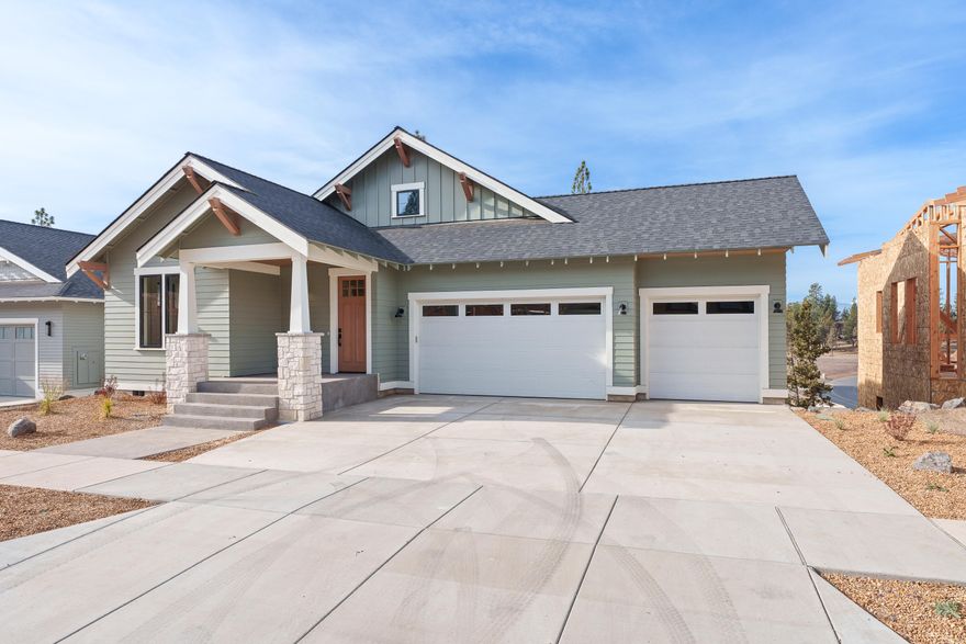 Welcome to this meticulously designed 5-bedroom, 3-bathroom home in the coveted Talline neighborhood. Offering 3,207 square feet of luxurious living space, this two-story residence harmonizes modern design with mountain town charm. The main level is the heart of the home, featuring an expansive open-concept living room with high ceilings and abundant natural light, seamlessly connected to the kitchen and dining area. The kitchen is outfitted with high-end appliances, an island, and plenty of space for preparing meals and gathering with family. Step outside onto the spacious porch, ideal for outdoor entertaining or enjoying the fresh Bend air. The main floor also features a serene primary suite with a luxurious ensuite bath, walk-in closet, and built-in storage. Additionally, two guest bedrooms and a full bath, plus a laundry room, make this floor functional for daily living. Upstairs, the bonus room offers a versatile space for a home theater, game room, or lounge.