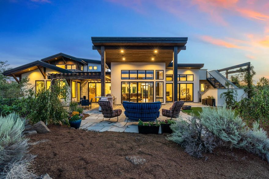 Modern luxury meets Central Oregon lifestyle at Pronghorn! Situated on a hilltop overlooking the world renowned Fazio golf course w/360 views of the Cascade Mtn range & beyond. Enjoy sunrises & sunsets from 2 rooftop decks, martini deck complete w/tv, theater sound, firepit & heater for year round comfort. Inside you'll discover tranquil colors & rich wood + stone & raw steel accents. Beautiful White Oak wide plank floors & hand made Arto tiles & stone counter tops. Picturesque windows throughout allow natural light to fill the interior & showcase the Chef's kitchen complete w/Wolf & Subzero appliances. Expansive cabinetry & built ins w/buffet & bar in dining area, modern gas burning fireplace & bold fixtures. Primary suite is a must see! 2 additional suites on the main level & 2nd story bonus room or 4th bedroom w/attached full bath. Hand chiseled flagstone patios, 3 bay garage w/Sprinter garage, epoxy floors, storage, dog wash station & much more. Tour of Homes Award winning home!