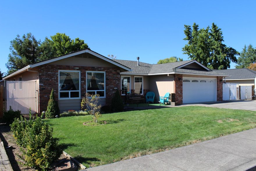 Awesome East Medford location close to everything you will find this beautiful home with a wonderful floor plan with Living room, family room (with a fireplace) dining room, 3
bedrooms and 2 baths. Home offers newer White Vinyl Windows, beautiful Bamboo wood Flooring, Carpet and Granite Counters in the kitchen. The backyard offers a large covered patio, a really good sized Shop that is approximately 10 x 16 and huge cement RV Parking behind a gated entrance.