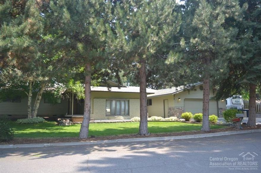 Great location, large single level home in established family neighborhood. Extensively updated home w/large kitchen, newer cabinets & appliances. Family room with slate floor & gas stove. Sunken living room has rock hearth & wood mantle with a fire place. Hot tub room off of master. Home features ceiling fans, walk-in closet, 4 bedrooms & an office, recessed lighting, skylights, laundry room. This home sits on a large beautifully landscaped fenced lot w/a green house. The heated garage/shop has 1400 Sq.ft.