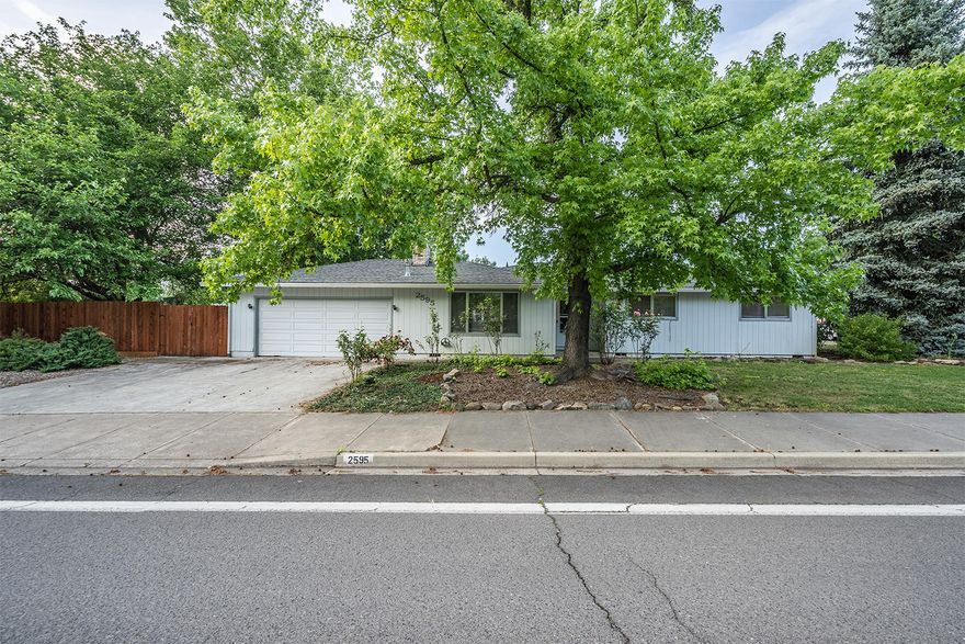 Don't miss the chance to make this home your own! Single level 3 bed, 2 bath on a huge corner lot just steps from the Rogue Regional Medical Center, Hoover Elementary, shopping opportunities and more! Large living room featuring a wood burning fireplace with charming brick surround. Spacious bedrooms, master with attached bath and loads of built in storage throughout.  Open kitchen with island, dining area and access to the back patio. Fully fenced, spacious backyard, 2 car garage with built in shop bench, and a huge side yard with room for additional storage, planting beds and more!