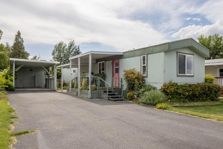 Welcome home to this cute and clean home in a quiet and small senior park! The home has been well cared for, including a lifetime, metal roof new in 2011 and then recoated in 2022. The range/oven, washer, dryer, and heat pump were all new in 2014. With 924 square feet and 2 bed/1 bath, the home is comfortable and includes a large pantry/laundry room, as well as a second pantry and extra storage in the hallway! Outside, the owners have lovingly cared for the grounds with pretty landscaping and even grape vines. There are also two sheds for extra storage, office space, or gardening tools! Behind the home is a nice, well-kept, grassy area that separates the other 15 homes in the park. The location of the park is hard to beat, with easy nearby access to nearby transit service, as well as a short distance to shopping and Three Rivers Medical Center. The low space rent includes water, sewer and garbage. Schedule your showing today, before this little gem is gone! No Dogs, Indoor Cats Only.