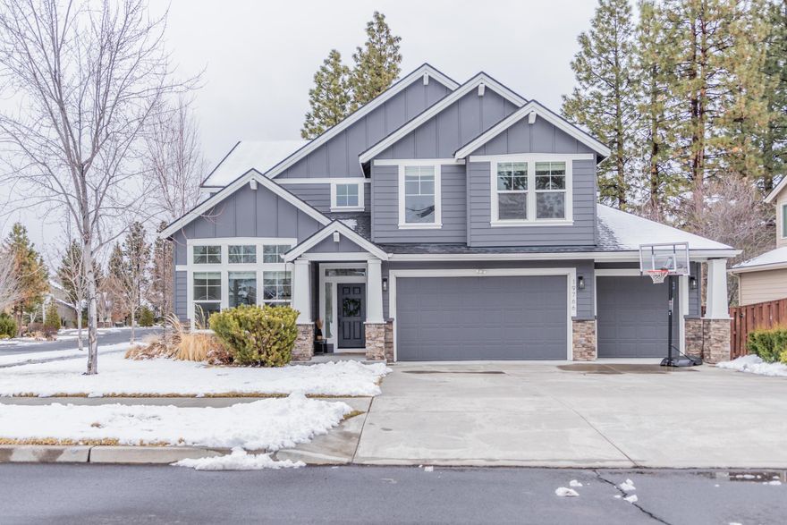 Stop your home search because this beauty checks all the boxes. This thoughtfully updated home in River Canyon Estates features wide plank, European white oak flooring that runs through the main level. New light fixtures, classy wainscoting, and a floor to ceiling paneled fireplace with white stone accents give the home a comfortable but upscale feel. The primary suite is situated off the family room and features a generous bathroom with a soaking tub, dual vanity, and spacious walk-in closet. Moving upstairs you are greeted by a vast open loft, oversized bonus room, and three additional bedrooms. But the real showstopper is this home's location. Situated on a corner lot, the home backs to a neighborhood greenbelt affectionately referred to as the pit. Sledding and snowball fights in the winter, baseball and slip n' slides in the summer. Not to be overlooked, the neighborhood has direct access to the iconic Deschutes River trail, offers a community clubhouse, fitness center, and pool.