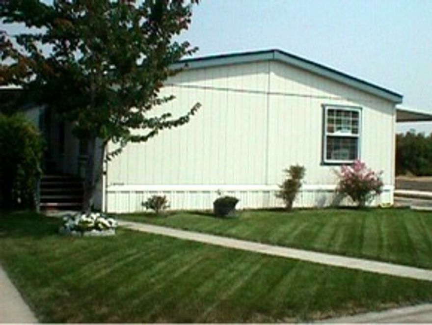 In park, must have current DMV license to show or sell. Like new manufactured home on an easy care lot with fenced backyard, covered deck, skylight, ceiling fans, split floor plan, storm doors, sensor lights in back. Neat and tidy Wonderful views with country feel. Owner motivated, submit all offers. Quiet all ages park with space rent of $280 per month.