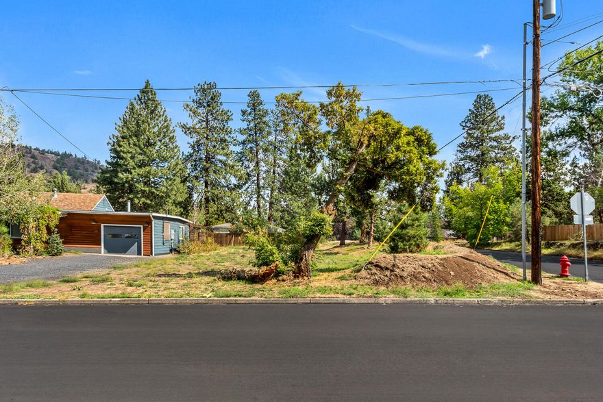 Located in the heart of Midtown Bend, this exceptional .11-acre homesite offers a rare opportunity to build in one of the city's most sought-after neighborhoods. The flat, buildable lot provides 48 feet of frontage and 109 feet of depth, giving you a versatile footprint for your dream home or next investment project.
With all utilities available at the street and underground power already in place, the groundwork has been laid for an efficient build. Whether you're envisioning a modern custom home or a savvy investment property, this prime location puts you close to parks, schools, restaurants, and the best of Bend's vibrant lifestyle.  A unique chance to secure land in Midtown—don't miss it.