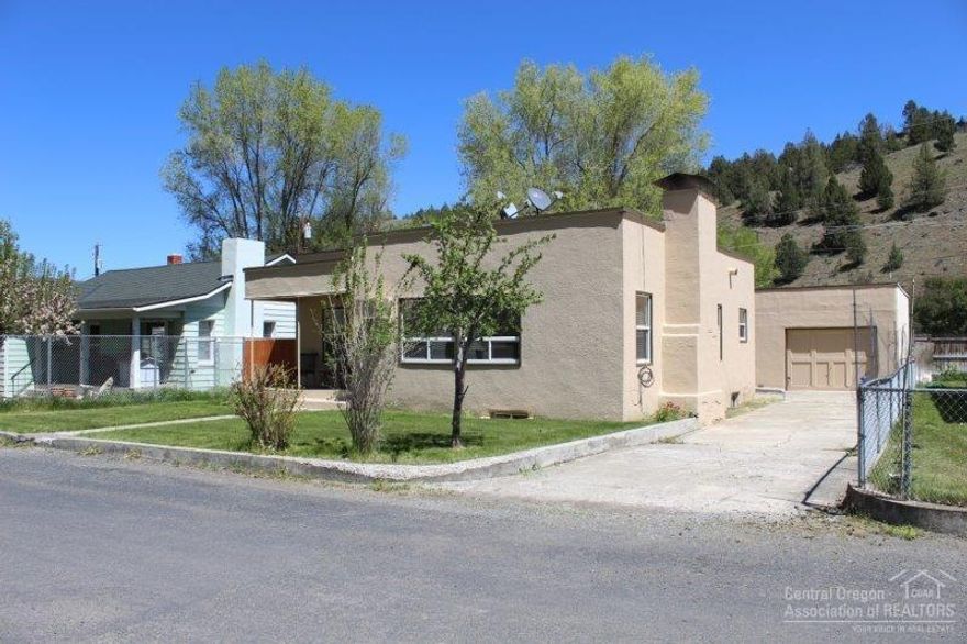 Move In Ready Living or Vacation Bungalow! See to appreciate the warm welcome feeling of 1175 sq ft of living space, upgrades include:, new paint, vinyl windows & flooring, 2 bedroom, 1 bath, plenty of storage, 442 sq ft of finished basement features: Knotty Pine walls, hobby & canning rooms, built in gun cabinet & vintage bar area making a great man cave or additional bedroom space, wood & oil heat, fenced back yard, garage. $129,000 #988