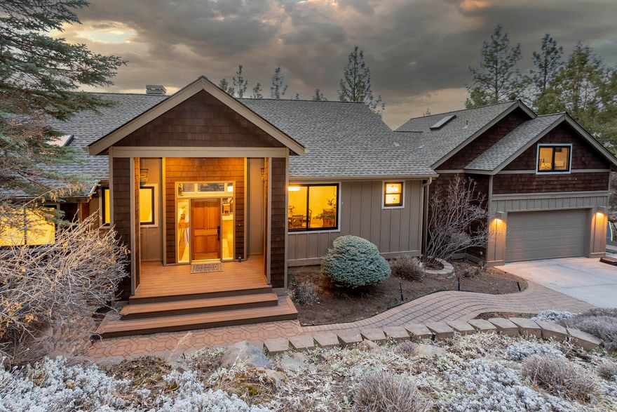 Welcome to your dream home with Cascade views situated on Awbrey Butte.  The main level features an open concept floor plan with high ceilings, ''HeatNGlow'' fireplace, built-in cabinets & walls of windows allowing plenty of natural light.  Spacious kitchen has center island, newer appliances, eating area, gleaming hardwood floors & sliding doors leading to the deck.  Primary bedroom is on main level which is large enough to have a sitting area, with walk-in closet, soaking tub, dual vanities, separate shower & views making this a hidden sanctuary away from guest bedrooms.  Downstairs you will find 3 guest bedrooms large enough to accommodate king-size beds.  The upper third level is a bonus room with space to convert to a 5th bedroom.  Enjoy outdoor entertaining on your deck for a BBQ, sunsets & wine.  New roof, heated driveway and much, much more!