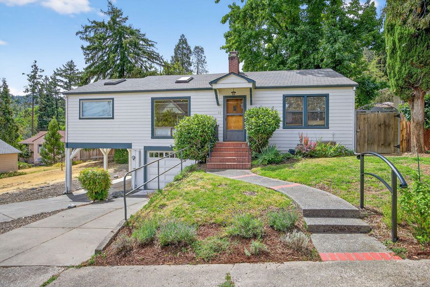 Rare Ashland treasure on highly desirable Nutley St, just steps from Lithia Park and all that downtown Ashland has to offer. Instantly fall in love with this home with expansive windows that fill the living space with light and frame picturesque views. The open layout offers spaciousness and at the same time a functional separation of space. Beautiful cabinetry, a dining nook and full dining area. Most of the living is on the main floor and includes a walk-in soaking tub, making it ideal for aging in place. The daylight basement is a great flex space with an updated bathroom, walk-in closet and new flooring. Outside, enjoy the oversized backyard with its gorgeous cobblestone walkway. With a second garage and additional yard space, the property may offer (per the City of Ashland) a potential for an ADU, Airbnb income, or even between 3-6 dwellings (buyer to verify). Truly a wonderful opportunity to own a lovingly maintained home in one of Ashland's most coveted locations.