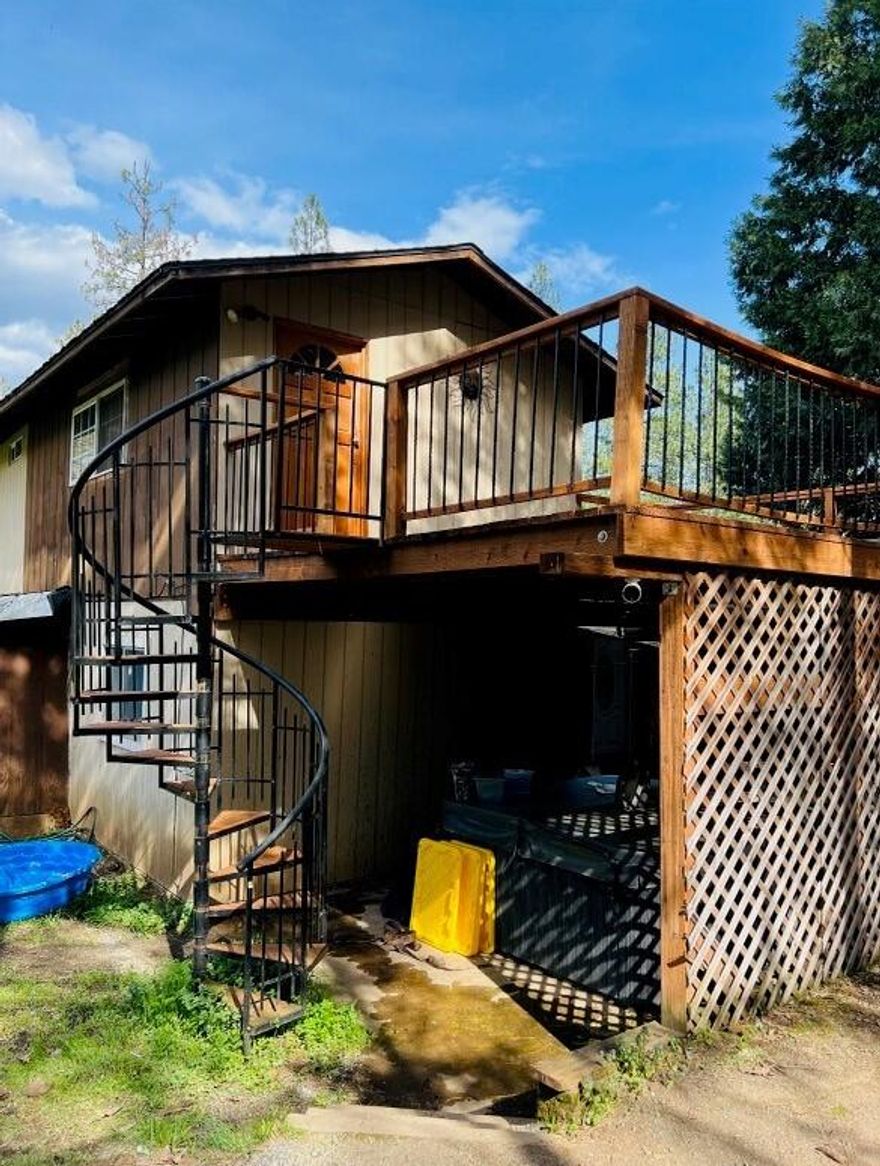 Beautiful property with tons of potential surrounded by beautiful homes. The acreage is very flat and useable. Also, in 2021 the seller built a large shop. Offers privacy and lots of trees. Inside offers an open floor plan with a large living room and a large kitchen. Large area upstairs could be a great master bedroom. Tons of potential here.