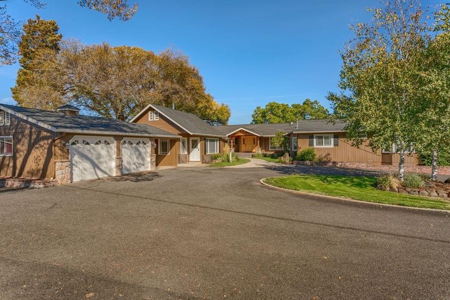 Horse Property w/5 irrigated acres 5 min to Downtown Jacksonville. French Countryside home & guest house over looking City Lights. Open beam ceilings, hardwood & travertine floors. 2 stone floor to ceiling stone fireplaces. Beautiful newer updates incl. a Lg chefs kitchen w/ every amenity (commercial dbl oven gas 6 burner cook top & griddle, warming drawer, beautiful cabinets, granite & wine refrige) Kitchen opens to dining & family rm, huge butlers pantry, great office/den off entry. Lg bedrooms. Master w/ dbl sinks, tile floors, walk in closet & private patio w/ hot tub. Many vaulted open beam ceilings. Very charming guest home w/ full kitchen, living rm, dining, full bath & 2 bdrms. 3 covered patios. In-ground pool w/ pool house & bath horse barn, riding arena, shop, extra covered parking. Basement / rec rm not incl. in sq ft.