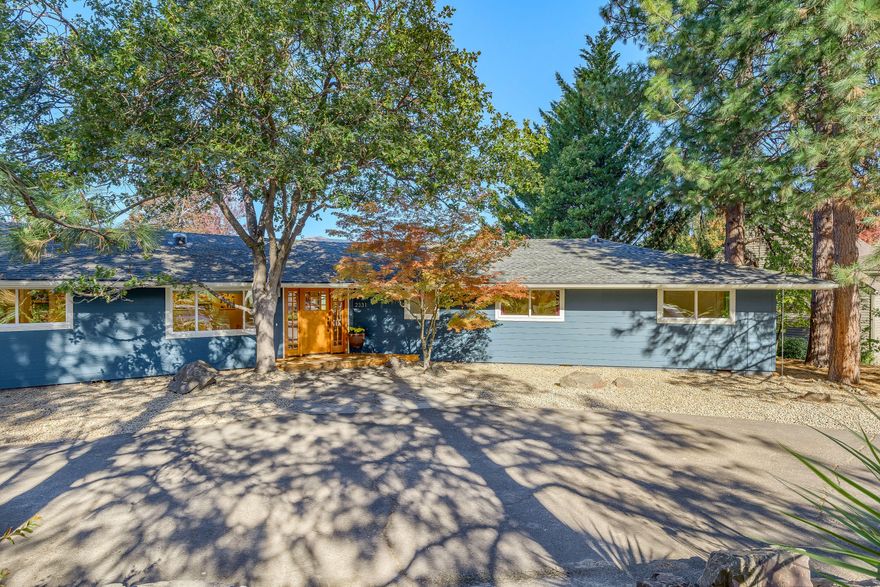 What a perfect place to call home. Plenty of space for all your indoor/outdoor needs. Potential 2-lot property on a large .65 acre corner (buyer to do their own due diligence). This single level home offers 4 beds & 2.5 baths. The floor plan is quite versatile, featuring two spacious living areas + a large office/rec room. Generous amounts of counter & cabinet storage in the light filled kitchen. There are dual pantries, an auxiliary bar area & eye catching island. You'll love the close proximity to hiking trails. Vaulted ceilings in the family room highlight the floor to ceiling wood-burning fireplace w/ stone surround. The master bath features a stylish vanity & easy access to the outdoor patio, hot tub & pool. The backyard patio is perfect for pool parties or a simple cup of coffee to enjoy the views of Cascades. Plenty of storage outside w/ three large storage sheds and an enclosed workshop. Plentiful vegetable garden, chicken coop and the list goes on.