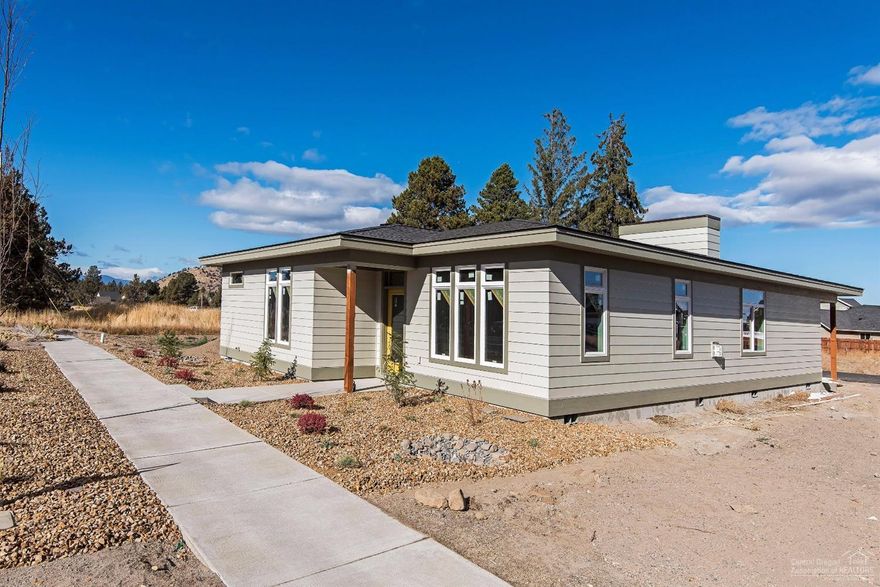 Come see this single story mid-century modern home featuring a great room floor plan with gas fireplace separating the dining and living areas, extensive laminate wood floors, tile and solid surface counters. Nice location near shopping, parks and schools.