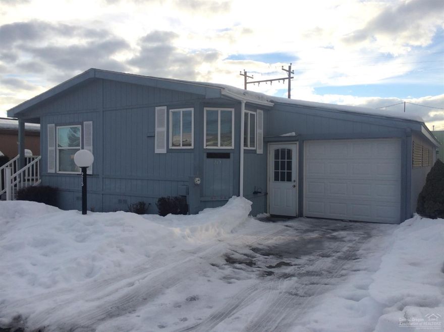 Nicely maintained home in 55+ park. Home is nice and bright with vaulted ceilings, AC, and all appliances included. Single car garage with storage shed and no maintenance yard. Newer energy efficient heat pump and ready for new owner. $451 monthly space rent includes water, garbage, sewer and yard debris + snow removal. Great community. Clubhouse has weekly/monthly events for all your social needs. Covered porch too. Welcome to SUNTREE VILLAGE!