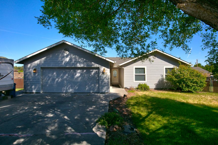 Rare opportunity to own a gorgeous single-level home perched on Redmond's Dry Canyon Rim with stunning canyon views. Set on a spacious 0.5-acre cul-de-sac lot, this home is filled with natural light thanks to large windows and upgraded blinds throughout. Step onto the expansive deck directly from the living area or primary suite and enjoy peaceful mornings watching canyon activity. Private backyard is fully fenced with sprinklers—perfect for relaxing or entertaining. Additional features include forced air gas heat, central A/C, 220V in the garage, attic ladder to storage, and direct access to the Dry Canyon trail system via Paul Hathaway Memorial Park. Incredible location close to all Redmond amenities. This one-of-a-kind property offers both comfort and a connection to nature—don't miss it!