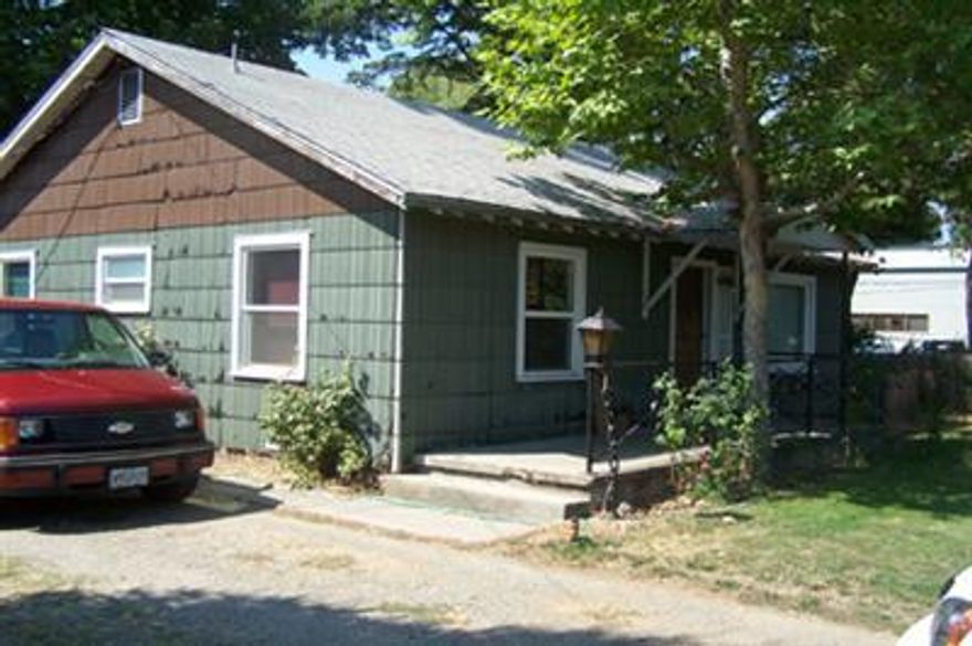 Excellent development opportunity for this .66 Acre commercially zoned parcel. Zoning allows for Business & professional offices, banks, medical, dental, retail stores & some service establishments. Conditional use allows for Multi-family(check with City of Rogue River for specifics). Ideal for Multi-family development - located behind new library & across the street from a grocery store, restaurants and other services. Currently two homes on property provide rental income while waiting to build.