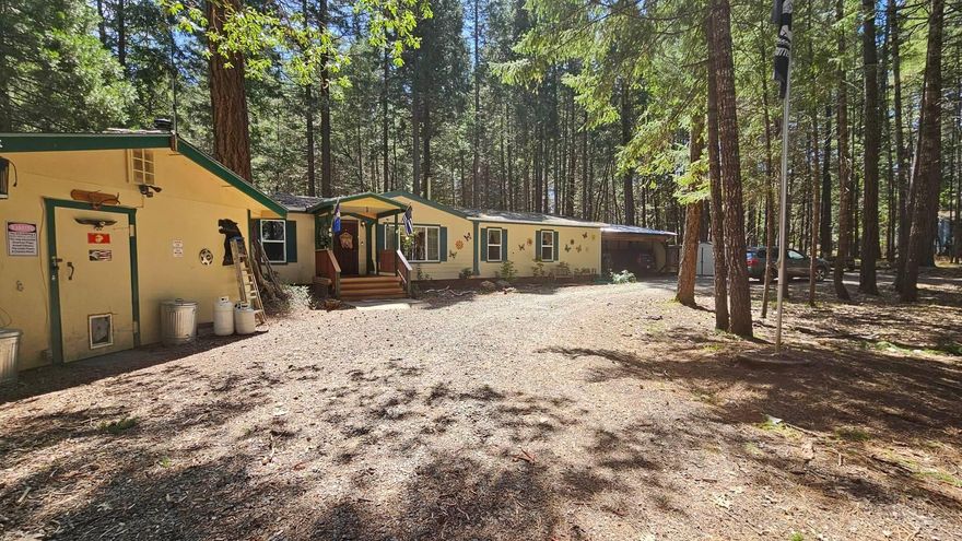 Are you looking for a peaceful and private retreat surrounded by nature? Look no further than this stunning property with 2.53 acres of wooded land, completely fenced for security and privacy with an electric gate and circular drive. The 1620 square feet of living space boasts three bedrooms and two baths. The room attached to the master bedroom could be used as an office, craft room, or nursery, providing endless possibilities for customization, and the remodeled master bathroom adds a touch of luxury to this beautiful property.
The property also features a charming shop with a bathroom, outdoor pantry, couple of sheds providing ample storage space for your tools and projects. For those who love to travel, there are two RV parking spots with hookups, one covered spot will come in handy for guests or for your own adventures.
Beautiful private backyard with a deck, outdoor kitchen and barbecue grill. Don't miss out on the opportunity to make this property your own private oasis!