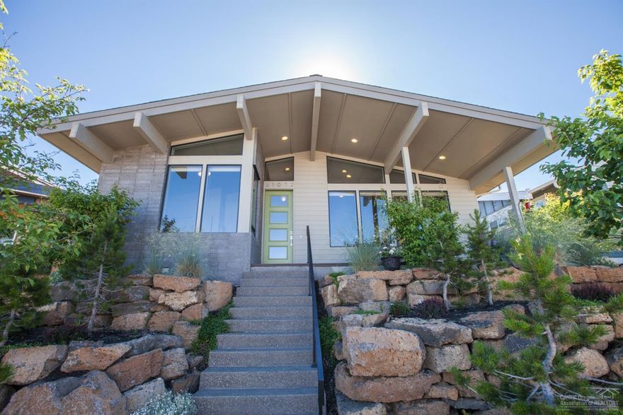 Immaculate, thoughtful and light filled Mid Century Modern home in Hidden Hills! This Tour of Homes Winner features designer finishes throughout including hard wood floors, custom concrete countertops, high end lighting package, glass tile backsplash and SS appliances. Set above the street for maximum privacy, take in your peak a boo mtn views from the front porch or enjoy entertaining out back. Energy efficient furnace, AC and interior ductwork make this home easy to enjoy all year round. Welcome home!