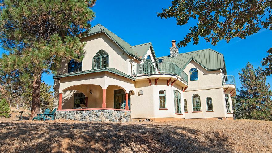 Welcome to the secluded serenity of the Ivan Lund 34 Acre retreat and only 3 minutes from downtown Historic Jacksonville. Ivan's vision and dream came together in the very custom one of a kind build.Beautiful, modern Tudor style home nestled in the hills of Jacksonville. This classic home features elegant craftsmanship and pride throughout. Stunning custom woodwork, heated main and upper level floors, gorgeous rounded archways and extraordinary custom windows throughout will give you a warm and inviting feeling from the moment you walk through the front door. This spacious home features 4 bedrooms, 4.5 bathrooms amongst 4628 sq ft, as well as a large 2 car garage w/shop and yoga studio to fulfill all your hobby, exercise and/or storage needs. The acreage is home to abundant wildlife and a seasonal pond. Very large indoor RV garage/ steel shop at the front gate of the property. This home is truly a stunning, one-of-a-kind build!