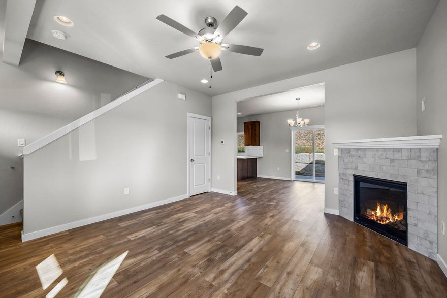 Don't miss your chance to live in the Stoneridge Terrace Community w/ miles of trails nearby! Spacious living both inside & out this Great Room plan w/ an open kitchen that features plenty of cabinetry & prep space on the slab Quartz counters. Full height designer tiled back splash, breakfast bar and SS appliances. Main living spaces offer luxury vinyl plank flooring, tons of natural light and plenty of room for gathering or entertaining. Spacious Owners Suite w/ walk in closet, dual vanities & enclosed toilet area. Three additional spare bedrooms share a full bath. Laundry room + additional half bath located on the main level. Double car garage, fully fenced, landscaped w/ sprinklers and complete w/ rain gutters. Pre-wired for A/C. Don't miss this one! Inquire about other floorplans in this neighborhood, still time to pick interior color packages on some! Photos are of another interior color package, but same layout/floorplan! Owner Carry options available!