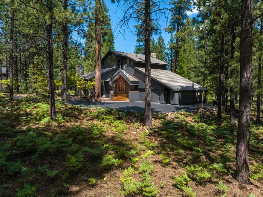 Stunning mountain modern home at Black Butte Ranch! Completely remodeled with top-tier materials and exceptional craftsmanship throughout. The great room features vaulted ceilings, a wood-burning fireplace, and custom built-ins. A chef's dream kitchen offers premium appliances, quartzite countertops, custom cabinetry, and a built-in pizza oven. This thoughtfully designed home includes 3 bedrooms, 4 baths, a versatile family/bunk room, and an attached two-car garage. Set on 1.25 acres — one of the largest, most desirable lots in the Ranch — the setting is truly remarkable, offering privacy and gorgeous golf course views. The expansive outdoor deck is perfect for entertaining, with stunning fire feature and a hot tub to enjoy peaceful evenings under the stars. A rare opportunity to own a high-quality, mountain modern retreat in one of Central Oregon's most iconic and sought-after destinations. Schedule your private showing today!