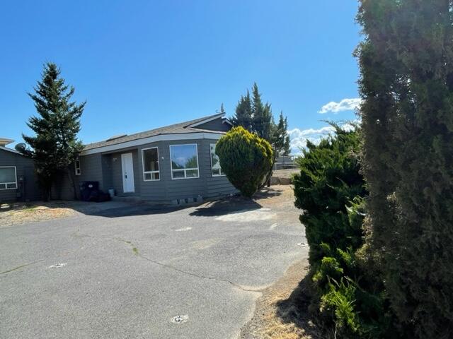 Seller will contribute $5,000 towards buyers closing cost at close of escrow. This property is not going to be on the market long, it's the only property under $300K in Redmond at the moment. These units are consider a duplex but they're on two separate tax lots. Sellers are only selling one side #1332. It's a great unit, 1156 sqft, 3/2 bedrooms, two parking spaces plus street parking and a backyard.  New paint inside, new flooring through out the home. Close to schools and shopping.