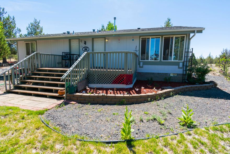 New Price: $319,900. !!!SELLER IS MOTIVATED!!! Welcome Home! Airy and bright, this cute  2 bed/2 bath 1100 sq ft manufactured on 1.7 acres is looking for a new family!  The property is fenced and cross-fenced. Plenty of room for your horses and all your toys. Sliding door from dining area leads to your deck (deck is not attached to mfg home) and your patio area done in pavers. Enjoy family barbecues on your patio or just sit in your hot tub!  Landscaped front and back. Certified Pellet stove . Garden tub and shower in primary bath. RV parking with water and electric. New roof in 2019 New well pump and casing in 2014. Pump house rebuilt in 2020. 24 x30 shop/garage, storage shed.   Call your favorite realtor today and make an appt to see this property!