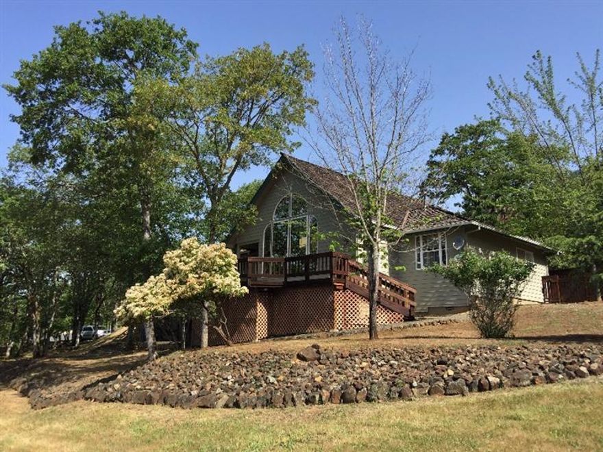 This gorgeous custom home is truly a cut above when it comes to well built and meticulously maintained comfortable living space. Nearly two story vaulted ceilings in the dramatic living room looking through a full wall of windows at the mountains and valley below. Split floor plan with convenient custom kitchen, tasteful skylights, roomy bathrooms, large laundry room, oversized finished garage, and efficient pellet stove to cozy up to. New carpets coupled with new interior and exterior paint make this home truly feel new. Lots of deck for entertaining and relaxing, and all this on nearly an acre and a half of remarkably usable ground in the heart of Colonial Valley. All information is deemed reliable but not verified; anyone considering purchasing this property should perform their own investigation into the uses and condition of the property.