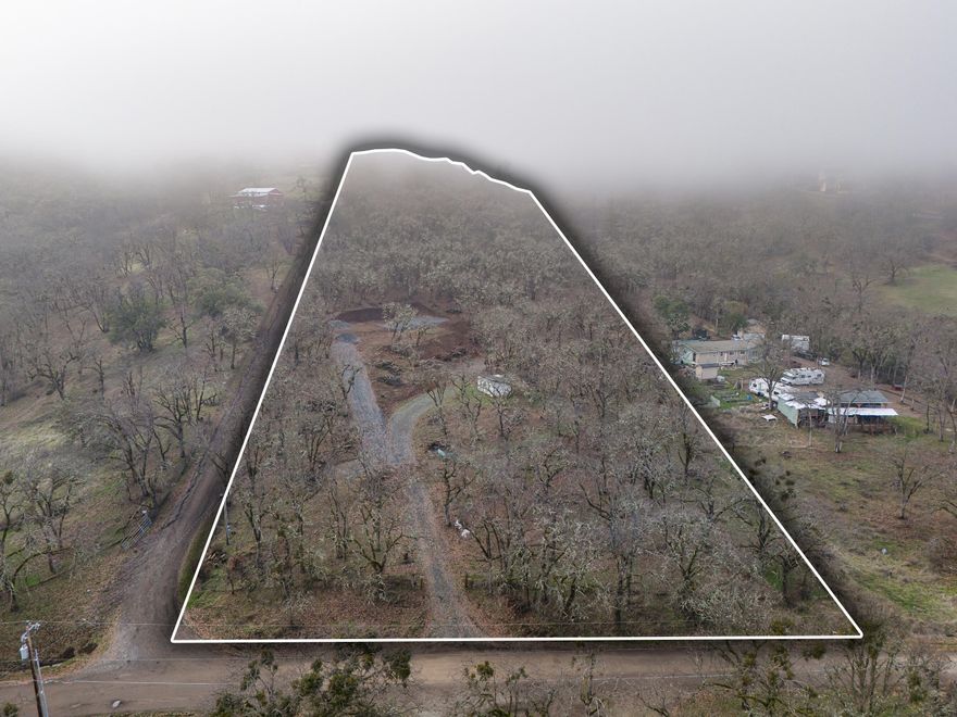 Location, location, location!! Looking for a large 5+ acre buildable lot in the heart of Sams Valley? If so, this is the one for you! This parcel is ready to go and features a brand new septic system, two wells (one of them is brand new), 2000 gallon underground holding tank, power is tied in, floor plans for new home design, perimeter fencing, fresh gravel, and new homesite pad! No CC&R's in the neighborhood allow manufactured homes to be built on this property as well! RR-5 zoning allows homesite approval too! This one won't last long on the market, so contact your agent today, before it's too late!