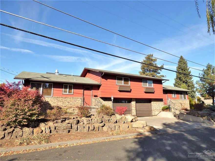 Location! Location! Less than 1 mile from downtown Bend, Drake Park and Mirror Pond. This CL zoned commercial corner lot allows for a variety of uses and it's right next to El Sancho Taco Shop & The Cake Lady. Pretty much a total remodel with new carpet, vinyl, sinks, light fixtures, faucets & most kitchen appliances. Exterior paint in 2016, newer roof, certified wood stoves, double pane vinyl windows, interior paint, doors, trim and much more. Triple sliding glass doors allow for a nice light living room.