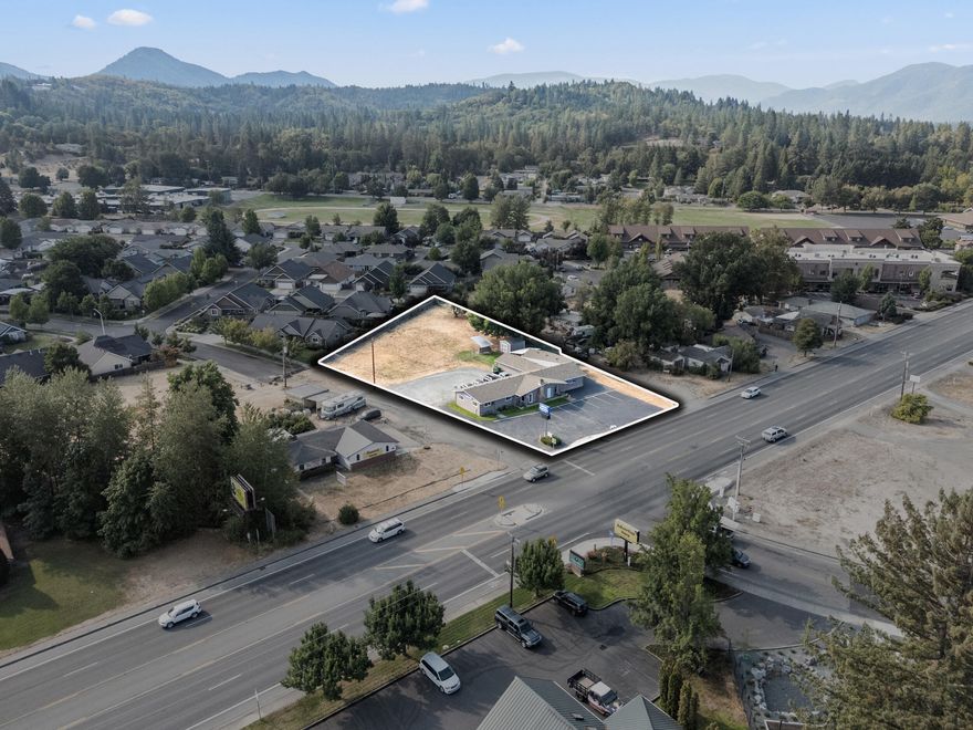Premier location with exceptional visibility/access along Williams Highway in the heart of Grants Pass commerce. Formerly the Animal Hospital of Grants Pass, this 3,391 sq. ft. office/CSFR commercial building offers a layout ideal for a veterinary clinic or animal care group seeking to establish or expand in a proven location. The stand out feature is the expansive .87-acre lot, with .41 acres designated as ''excess land'', creating immediate upside for expansion, new construction, or subdivision. General Commercial (GC) zoning supports a wide range of in-demand uses and provides a clear pathway for redevelopment or adaptive reuse. This property represents a rare opportunity for investors, developers or owner-user to acquire a substantial commercial parcel defined by its strategic location, significant land component, and exceptional development flexibility.