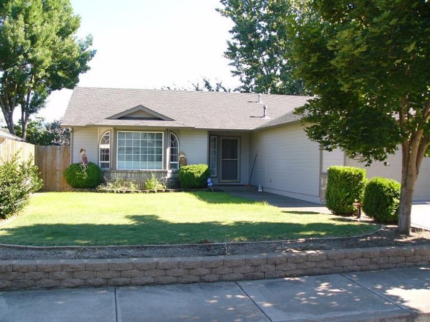 Very well maintained 3 bdrm/2 bath with great floor plan. Beautiful open custom kitchen with cherry cabinets, upgraded stainless appliances, granite counter tops, double-door pantry. Master bdrm sliding door connects to back patio. Covered patio off dining room through additional sliding door. Vaulted ceiling in living room. Garage has been remodeled to include an office on one side. Ceramic tile and wood floors with carpeted bedrooms. Heating/cooling, plumbing and roof in great shape. Detached 8x12 shop and additional garden shed. RV parking adjacent to driveway. Nicely landscaped with sprinklers in front yard. Water heater just replaced.