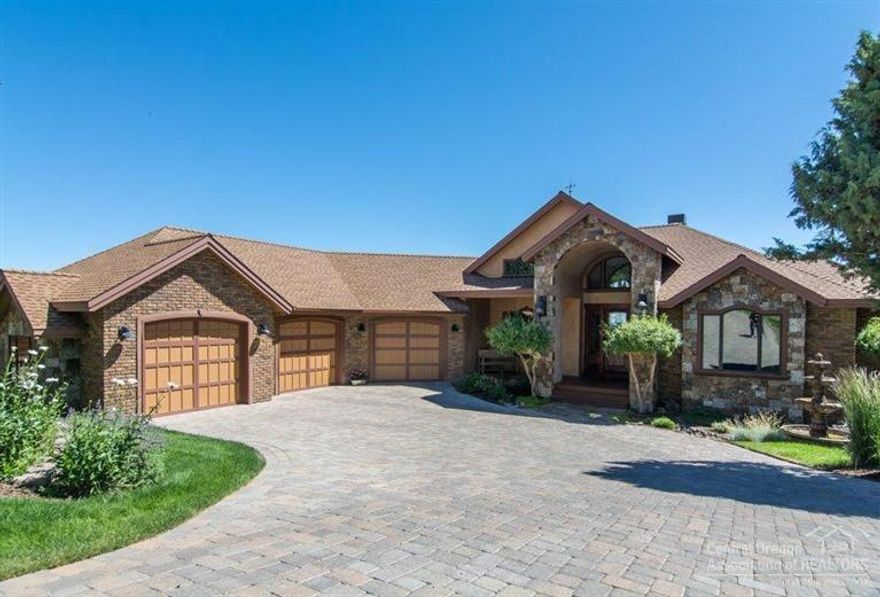 Surround yourself in the luxury of this Tour of Homes award winning home in NW Bend with stunning 180 view from Jefferson to Smith Rocks, the rugged Deschutes River, and city . With great attention to detail, the light and airy home features exposed beams, gourmet kitchen with use of stone, stainless appliances, rich woods, and wide plank mahogany floors. Vaulted great room, main level master and office, family/bonus room, spacious decks with expansive views. Awards for best finishes, garage and wine cellar