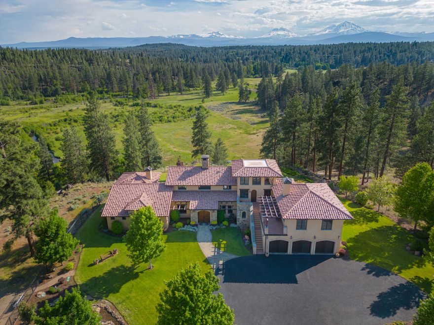 This is a testament to timeless grandeur. Nestled within Deschutes Land Trust's preserve, in the heart of Central Oregon, this remarkable 67 acre estate offers an enduring legacy that will be treasured for generations to come. The primary residence, spanning 5,050 sq ft, boasts three bedrooms, five bathrooms, and a chef's kitchen. Hand-carved hickory and heated stone floors exude warmth, while twenty-foot ceilings and expansive windows provide stunning views. The property features a private-access apartment suite, custom cabinetry, a heated three car garage, and manicured landscaping. Enjoy mountain vistas, an outdoor kitchen, and a fire feature in the courtyard, as well as direct access to private land for fishing and wildlife viewing. On this sprawling estate you will also find two other full residences. Home two is single story with 1,700 sq ft, 2 bed, 2 bath, and a two car garage. Home three is two story with 2,200 sq ft, 3 bed, 2 bath, and a 2 car garage.