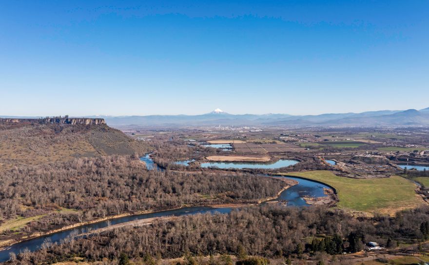 If you are looking for some elbow room. with spectacular views of the lower table rock, Mt. McLaughlin and the Rogue valley and the Rogue River. This could be your new custom home built in 2000 with three bedrooms, two and a half bathrooms plus an office. This is a very well built home and also very well maintained home. The master bedroom is on the main level with a large master bathroom a walk in closet and a sun room off the back with removable Plexi glass covers, large office has a built in desk, the laundry room is oversized with tons of storage and large cabinets. The kitchen is outfitted with beautiful custom shaker style cabinets, granite and Corian countertops with high quality Sub Zero and Bosch appliances. The sunken living room offers great views The home is Solar Powered, the heating and air is Geo Thermal. The 26x36 Shop was built in 2018. This home has many more features to see. Call today for an appointment today.