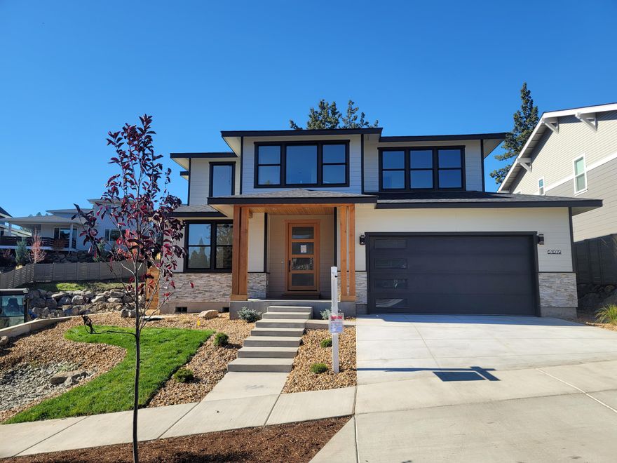 Check out this stunning contemporary two-level luxury home located in the desirable Hidden Hills community. The house offers 2265 sqft of living space, an additional 899 sqft garage, and a 277 sqft covered patio for comfortable living. The open floor plan allows for an abundance of natural light, highlighting the spacious great room and beautiful kitchen with quartz countertops, stainless steel appliances, pantry, and large kitchen island that opens to a dining area. This home offers custom cabinets throughout, and gas fireplace in great room with stone surrounds. The hardwood floors, generous master suite with luxury fixtures, and walk-in closet are fabulous features that make this home stand out. Additionally, the fenced yard with landscaping and an irrigation system is perfect for outdoor relaxation. The neighborhood is great, with convenient shopping and close proximity to the Alpenglow Community Park.