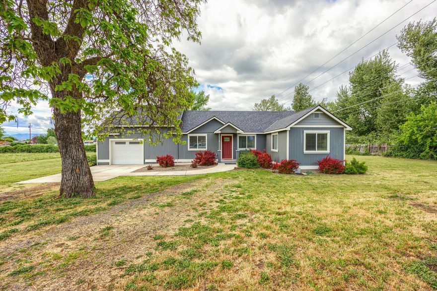 Fantastic remodeled home with a great country setting, yet close to town. This home & property offer 2.9 flat, usable acres and is in the city of Central Point. Home features 3 bedrooms, 2 full bathrooms, approx. 1157 sq ft, separate utility/laundry room and abundant natural lighting, attached one car garage. small barn/shed and irrigation rights. Remodeled in 2020/2021 down to the studs and offers all new kitchen with
range/oven, dishwasher & garbage disposal, 2 bathrooms with tub/shower combos, exterior siding, composite deck, flooring, vinyl windows, roof, cabinetry, lighting, fixtures, doors, trim & more. Backyard offers a deck, small barn/shed. Home sits towards the back of the property and near the creek. Irrigation rights & creek frontage: one tax lot is 1.3 acres w/the home & barn/shed & the other is land only with 1.6 acres. Buyer to do their own due diligence regarding the use of the property. Located near schools & the Central Point arboretum. RV parking & more.