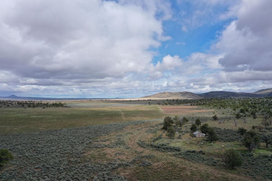 Welcome to the Buckboard Homestead! This amazing high desert property rests 89 miles east of Bend and 58 miles west of Burns off Hwy 20. Serving as a cow camp for over a century, this 640-acre property that has been split into three contiguous 213-acre parcels. The parcels are perimeter and cross fenced with three-strand barbed wire surrounded by seemingly endless BLM. The cabin is a recorded structure per the assessor records and can be replaced or improved with county approval (buyer to perform due diligence), and the functioning well pumping at +/-10gpm offers an excellent water source. This property does qualify for LOP tags (buyer to confirm with ODFW). Whether you are searching for cattle ground or looking to create your own Central Oregon escape and relive the glory of the Old West, the Buckboard Homestead provides limitless potential for the discerning buyer.