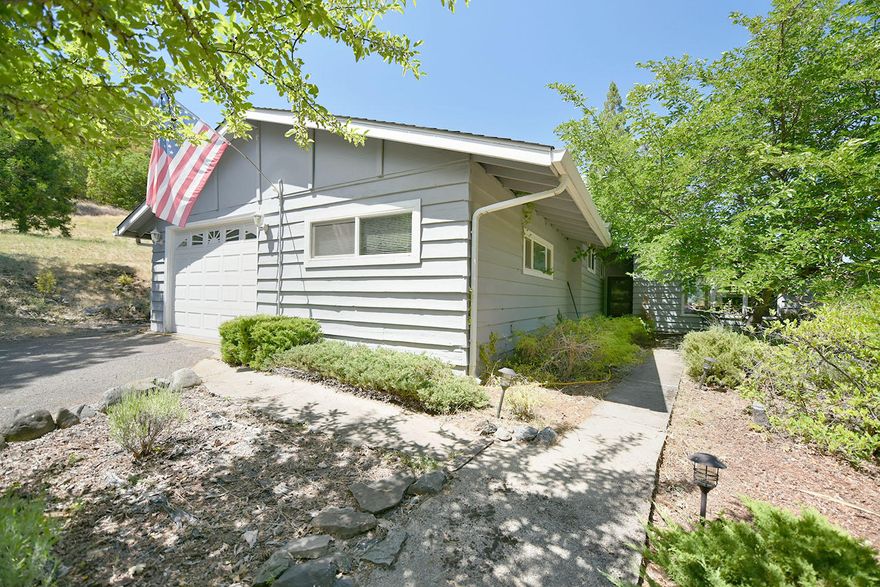 Charming 2 bed 2 bath on .42 acres..needs some TLC, but has soo much potential!