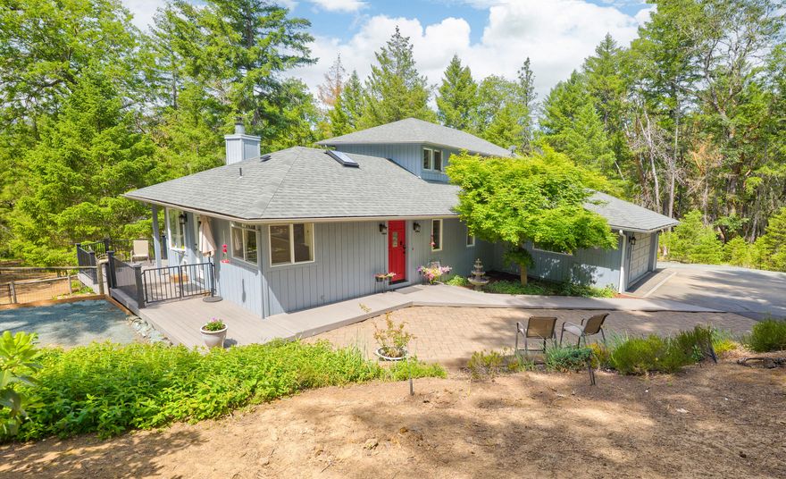 Welcome to your peaceful 4-acre retreat in Shadow Hills Estates! Surrounded by trees and next to an 80-acre forest, this home offers privacy and serenity. Step inside to a light and bright kitchen with new stainless appliances (2024), perfect for cooking while enjoying nature views. The cozy sunken living room with a woodstove creates a warm, inviting space to relax. The spacious primary upstairs bedroom offers a peaceful retreat with views of the trees with 2 additional bedrooms on the main floor. Updates include a new heat pump (2024), water filtration, and water heater (2023). Enjoy a 1,225 sq ft finished shop with 10-ft walls, 100-amp power, mini-split HVAC, and RV parking.