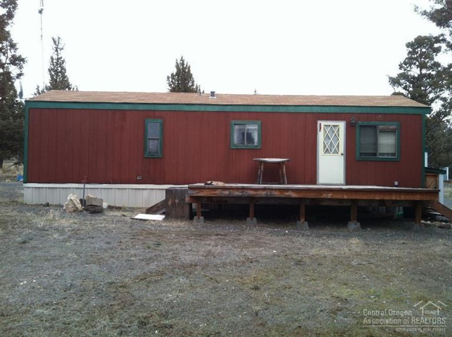 Fantastic shop 1440 Sq. ft. Concrete floors, on 1.820 Acres, Shared well, 560 sq. ft. single wide 14x40 1 bedroom 1 bath. 1991 very livable. Completely fenced with trees. Horses are ok.