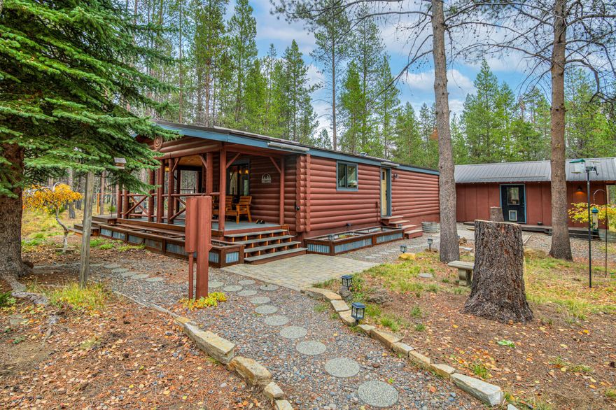 Looking for 4.9 acres just outside Sunriver and just minutes to Mt. Bachelor and the High Cascade Lakes? This property has a lot to offer with 3 buildings, fenced yard, Large deck and a paver patio with fire ring for outdoor entertaining. Lots of room for RV's and other utility toys and trailers. Large ponderosa pines and lodgepole trees throughout the property. This home has a log accents and a metal roof a great Central Oregon look. 2 bedrooms, 2 bathrooms, Large open Great room with a wood fireplace stove. This home has lots of updates from granite counter tops to wood style floors throughout the home, Stainless steel appliances, newer wood doors and wood trim. There is a 576 sq. ft detached oversized 2 car garage and a 352 sq. ft separate bonus room for storage or arts and crafts. There is a wood shed with a dog run. This home has a lot to offer.