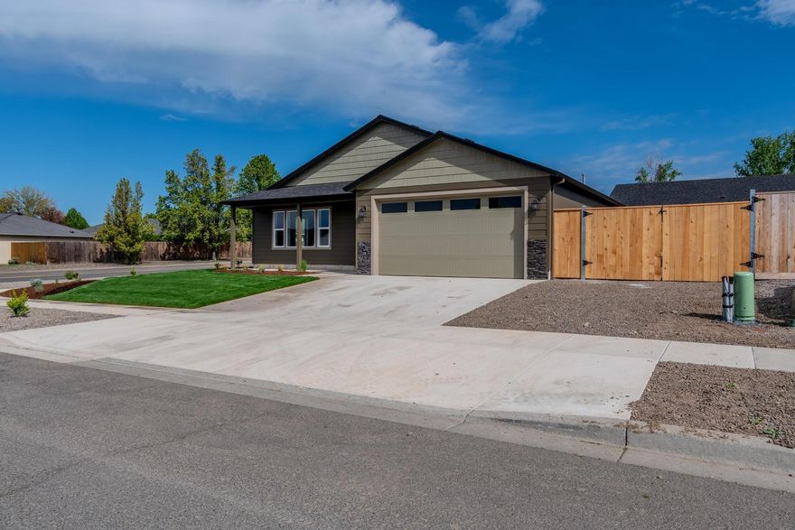 WOW! This gorgeous new home features an amazing open living area with breathtaking vaulted ceilings in the great room located on .16 acre lot! Plenty of windows flood the space with beautiful natural light! The stunning kitchen showcases eye-catching granite countertops, natural gas range, microwave hood and plenty of storage.
Sitting on an impressive corner lot with hard-to-find double gates for your RV or toy parking. Both the front and back yard are completely fenced and professionally landscaped - no extra work needed! This custom home is 100% move-in ready!
Don't miss your chance to own this incredible property - just bring your furniture and start living your dream today!