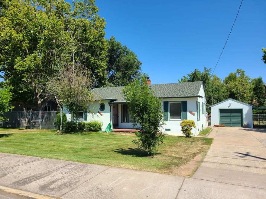 Super clean and nicely maintained home on a large lot with mature landscaping and tons of extra space. This oversize property has a large fenced backyard, RV parking and a detached garage, plus a covered carport. There is additional storage located behind the garage. Many recent updates include vinyl windows, roof, electrical panel, water heater, heat pump, laminate flooring and carpet, and exterior paint. There is a breakfast nook and laundry is located within the home off the kitchen. This home is move-in ready and a must tour.