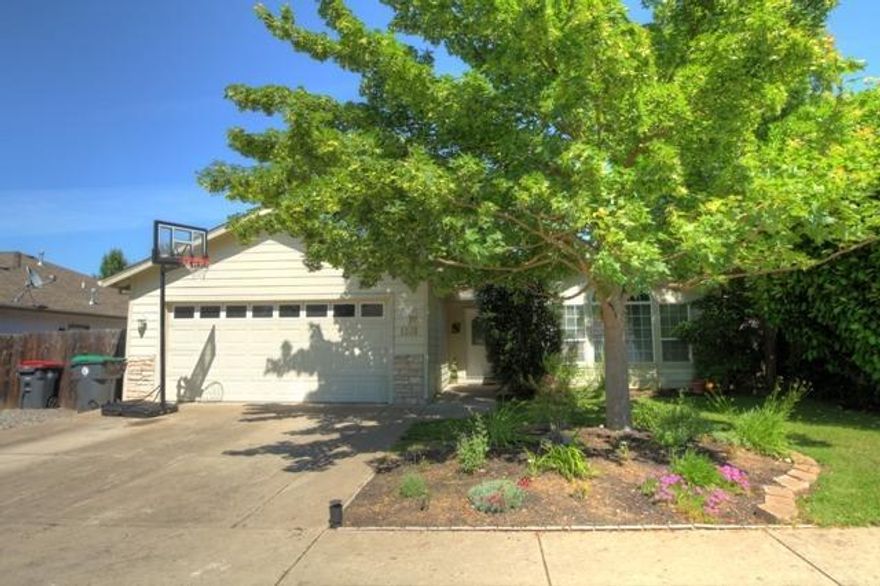 Beautiful single level home in Elk Creek Estates with a spacious great room design. Light and bright kitchen with new stainless refrigerator, dishwasher and microwave. Convenient breakfast bar, pantry and dining area. Updated beautiful laminate flooring throughout living area. Large master suite features a ceiling fan, double sinks and shower. Nice inside laundry, covered patio, new deck, a 2-car finished garage and potential RV parking. This home is neat and tidy and in move-in condition!