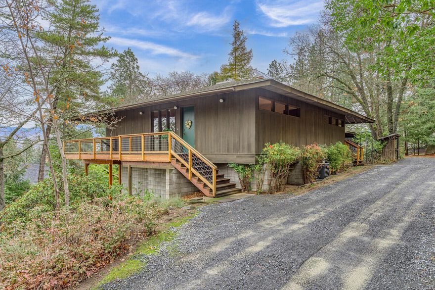 Amazing Mid Century modern one owner home. The vision at the time built is incrediable for today's home style. Panaramic views all the way to Table Rock on a clear day. Grizzly Peak is in full view from large deck as well as living/dining/kitchen. Full glass front with two sliders to deck. Open floor plan, walnut cabinetry in kitchen, dining built ins, cedar T&G cathedral ceilling. Primary and second bedroom on main level with full bath. Downstairs has 3 bdrms, bath, family room/work room and laundry room.  Fenced garden area leads to huge work shop under double carport or convert to garage with garage door.  Great location, about 11 blocks to downtown,  room for RV parking and several cars on the long level driveway.  Solid home with remarkable features.  Come look today as this home is so special with fresh interior paint, newer deck, cascading wood ceilings in a quiet neighborhood with a neighborhood park 2 blocks away.